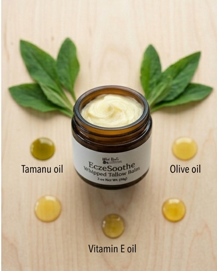 Balm jar with Tamanu, Olive, and Vitamin E oil labels on a wooden background