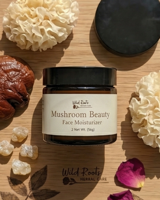 Collage of Wild Roots mushroom beauty product packaging with natural elements on a wooden surface.