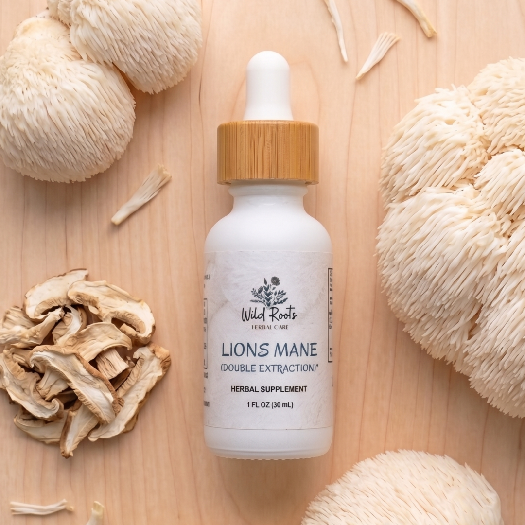 Bottle of Wild Roots Lions Mane supplement on a wooden surface with lion's mane mushrooms.